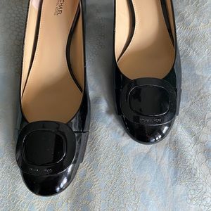 Michael Kors black patent pumps